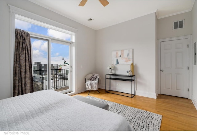 bedroom with access to exterior, light wood-style floors, crown molding, baseboards, and ceiling fan