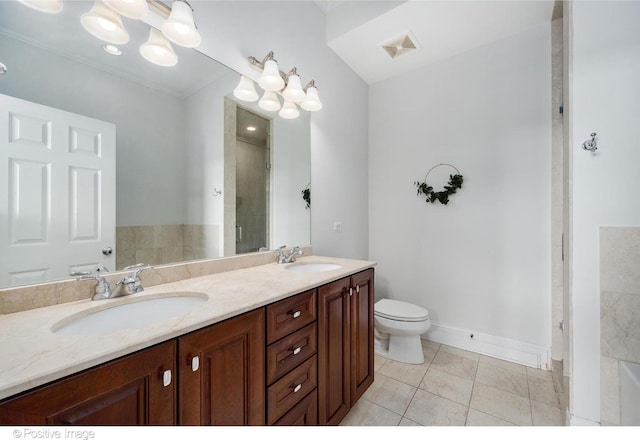 bathroom with double vanity, a tile shower, a chandelier, toilet, and baseboards
