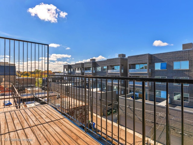 wooden terrace with a residential view