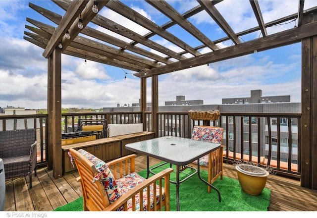 deck with a pergola and outdoor dining space