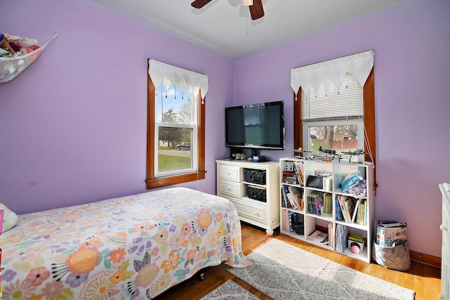 bedroom featuring a ceiling fan and wood finished floors