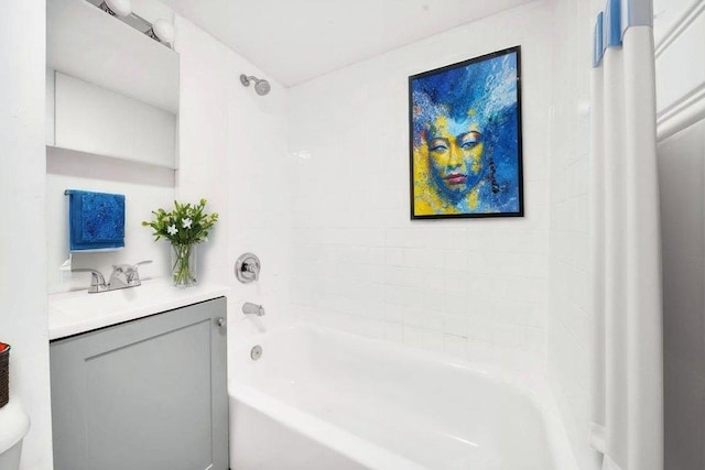 bathroom with vanity and shower / washtub combination