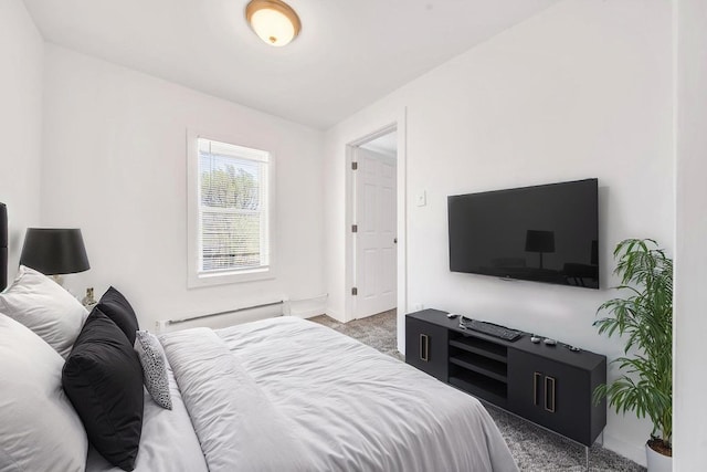 carpeted bedroom with baseboards