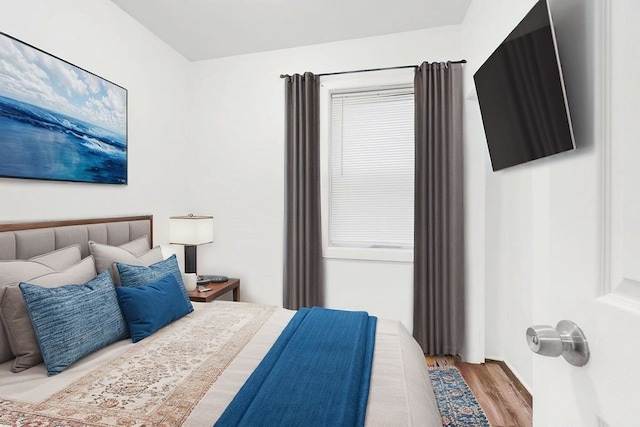 bedroom featuring wood finished floors
