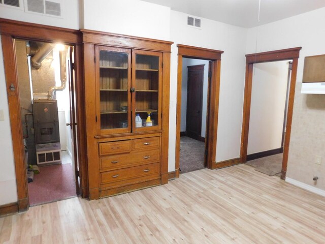 4134 W 21st Pl, Chicago, IL 60623 - interior space featuring visible vents, light wood-style flooring, and baseboards