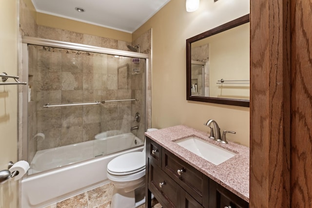 full bathroom featuring toilet, crown molding, vanity, and combined bath / shower with glass door