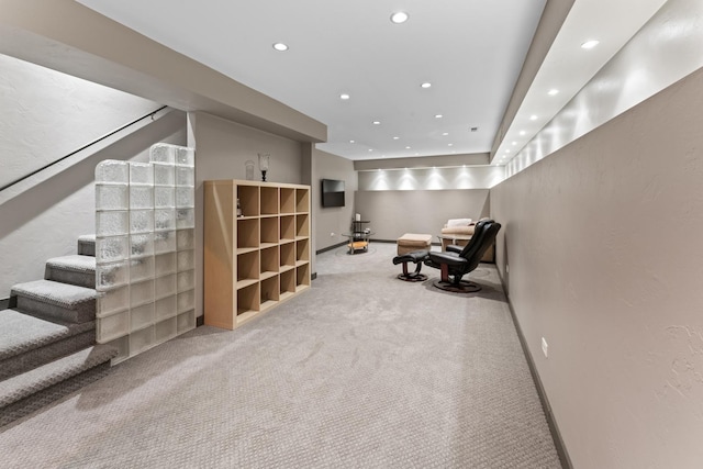 interior space featuring carpet flooring, baseboards, recessed lighting, and stairs