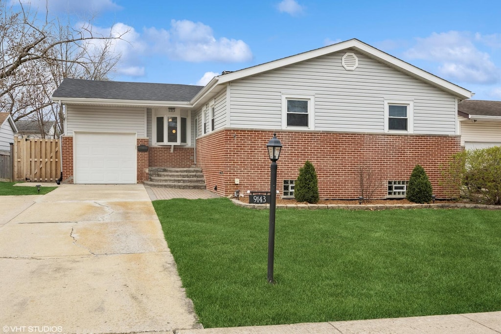 ranch-style house featuring concrete driveway, a front lawn, brick siding, and a garage