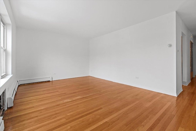 415 S Maple St Unit 402, Oak Park, IL 60302 - empty room with baseboard heating and light wood finished floors