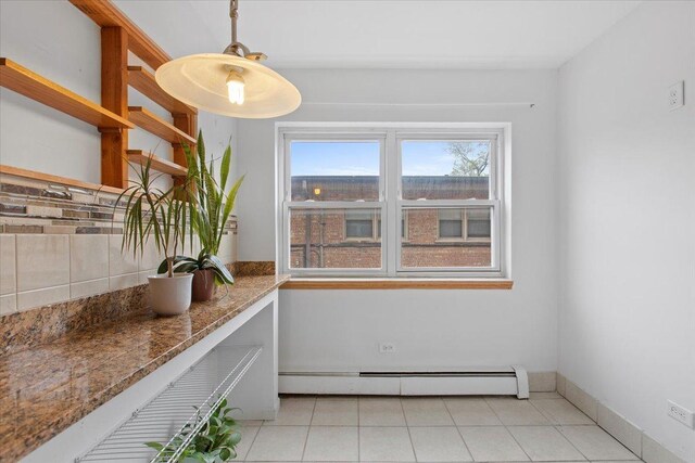 415 S Maple St Unit 402, Oak Park, IL 60302 - dining area featuring baseboard heating and light tile patterned flooring