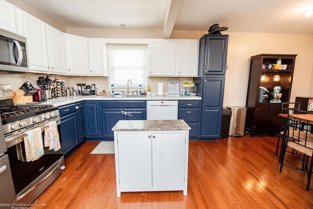 536 Evergreen Ln, Bradley, IL 60915 - kitchen featuring a sink, appliances with stainless steel finishes, blue cabinetry, and wood finished floors