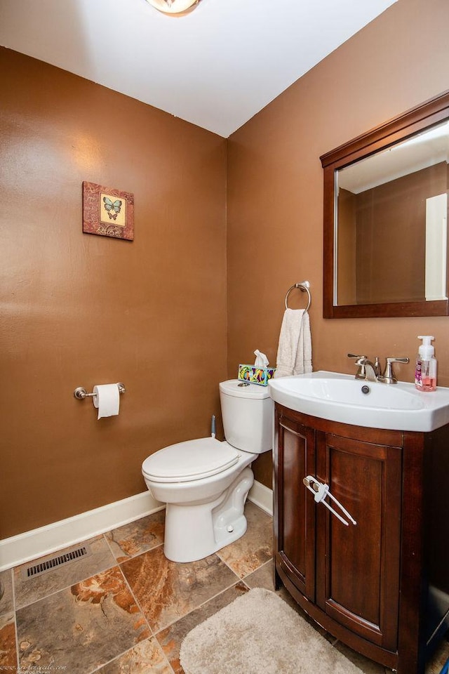 536 Evergreen Ln, Bradley, IL 60915 - bathroom with vanity, visible vents, baseboards, and toilet