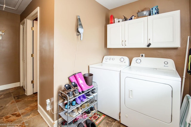 536 Evergreen Ln, Bradley, IL 60915 - laundry area with baseboards, washer and dryer, attic access, stone tile floors, and cabinet space