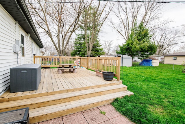 536 Evergreen Ln, Bradley, IL 60915 - wooden deck featuring a shed, an outbuilding, and a lawn