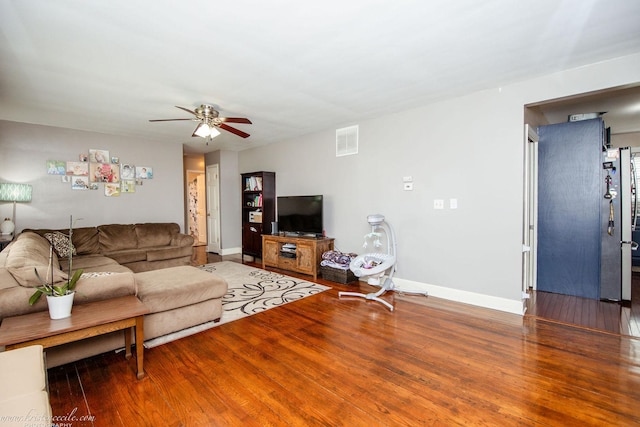 536 Evergreen Ln, Bradley, IL 60915 - living room with visible vents, baseboards, a ceiling fan, and wood finished floors