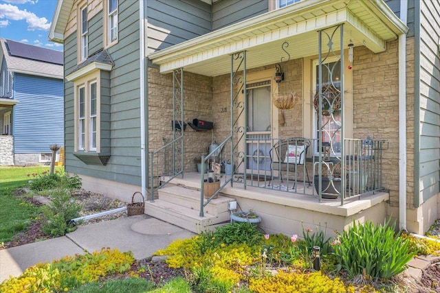 entrance to property featuring covered porch