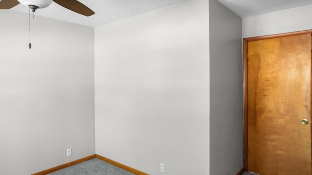 interior space with ceiling fan, baseboards, and carpet floors