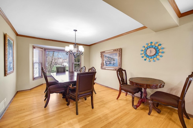 2894 Whispering Oaks Ct, Buffalo Grove, IL 60089 - dining area with light wood-style floors, ornamental molding, and a notable chandelier