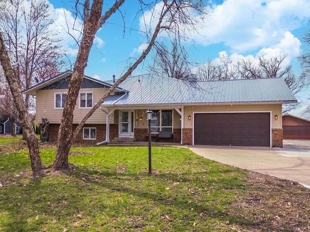 10690 E 1700 N Rd, Pontiac, IL 61764 - tri-level home featuring a front yard, metal roof, a garage, concrete driveway, and brick siding