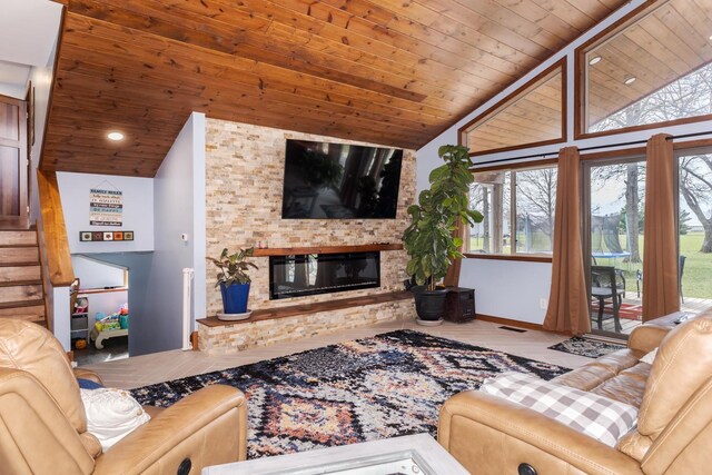 10690 E 1700 N Rd, Pontiac, IL 61764 - living area featuring visible vents, wood finished floors, wooden ceiling, and a glass covered fireplace