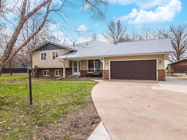 10690 E 1700 N Rd, Pontiac, IL 61764 - tri-level home featuring brick siding, a front yard, an attached garage, and concrete driveway