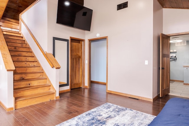 10690 E 1700 N Rd, Pontiac, IL 61764 - interior space featuring visible vents, baseboards, a high ceiling, and wood finished floors