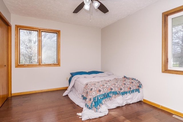 10690 E 1700 N Rd, Pontiac, IL 61764 - bedroom featuring a closet, baseboards, a ceiling fan, visible vents, and wood finished floors