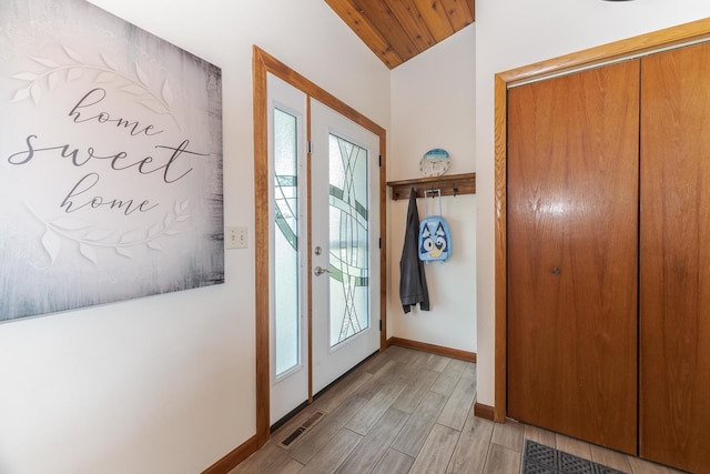 10690 E 1700 N Rd, Pontiac, IL 61764 - doorway featuring visible vents, baseboards, wood ceiling, light wood finished floors, and vaulted ceiling