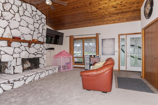 10690 E 1700 N Rd, Pontiac, IL 61764 - living room featuring carpet, a ceiling fan, a stone fireplace, wooden ceiling, and lofted ceiling