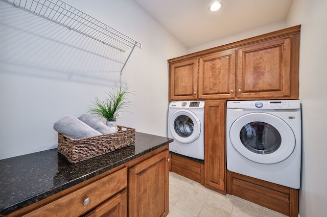 laundry area featuring recessed lighting, cabinet space, light tile patterned flooring, and washing machine and clothes dryer
