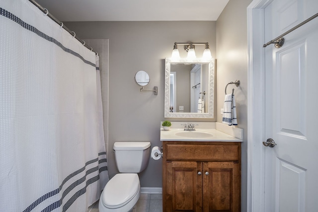 bathroom featuring vanity, tile patterned flooring, a shower with curtain, and toilet