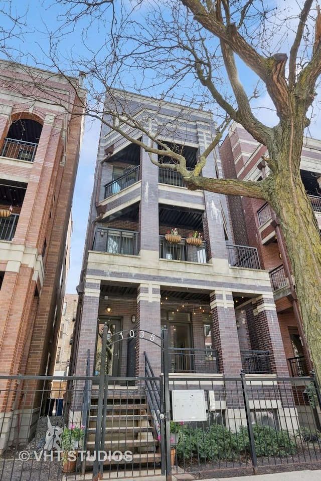 view of building exterior with a fenced front yard
