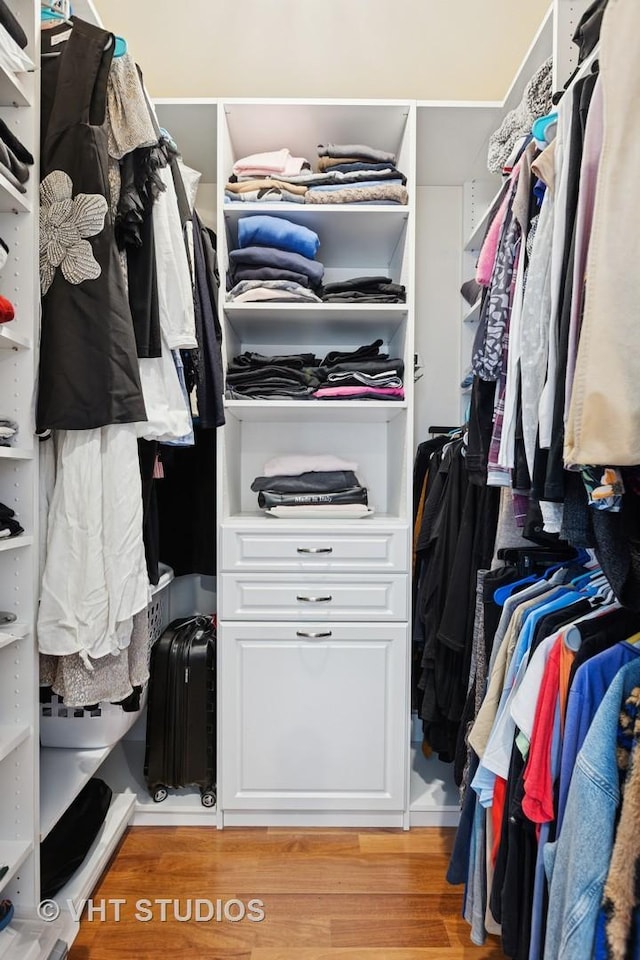spacious closet featuring light wood finished floors