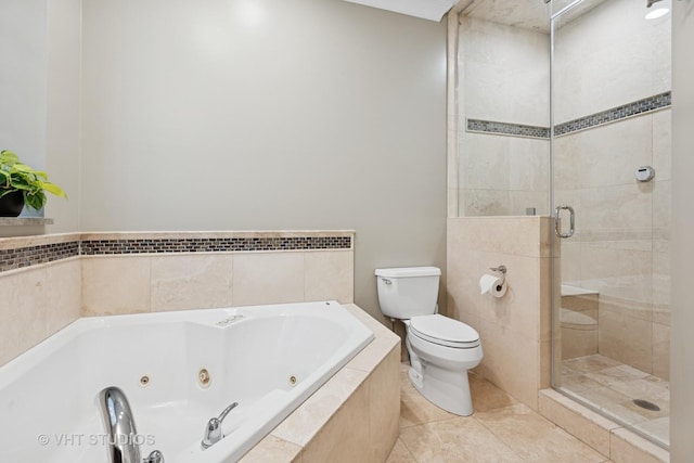 bathroom featuring toilet, a stall shower, a whirlpool tub, and tile patterned floors