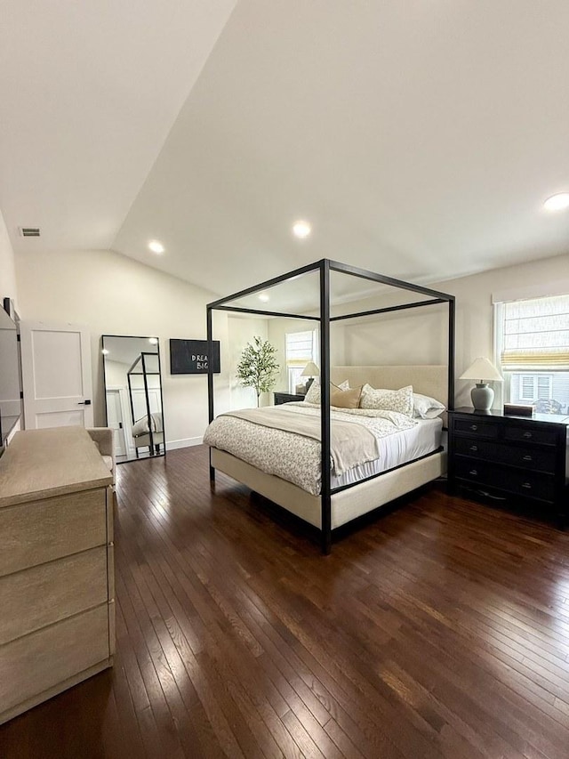 bedroom with recessed lighting, dark wood-style flooring, lofted ceiling, and visible vents