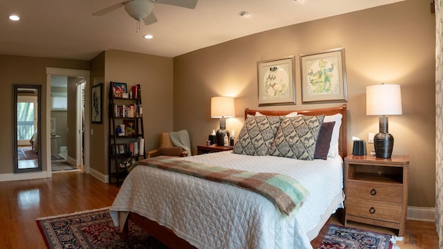 bedroom with baseboards, wood finished floors, recessed lighting, and ceiling fan