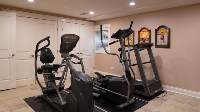 workout area with baseboards and recessed lighting