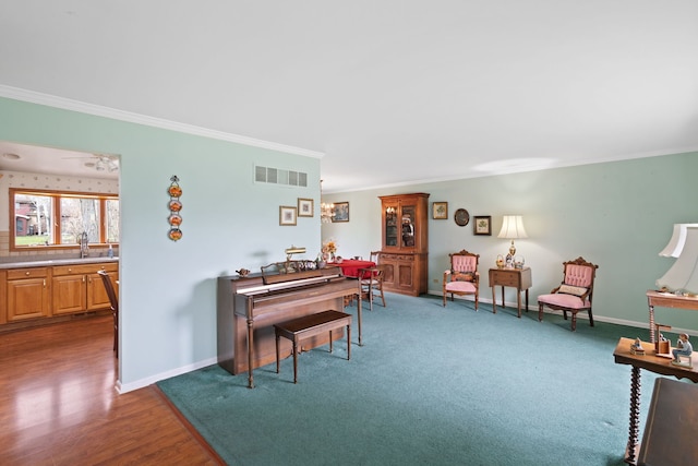 18524 Center Ave, Homewood, IL 60430 - sitting room featuring baseboards, wood finished floors, visible vents, and crown molding