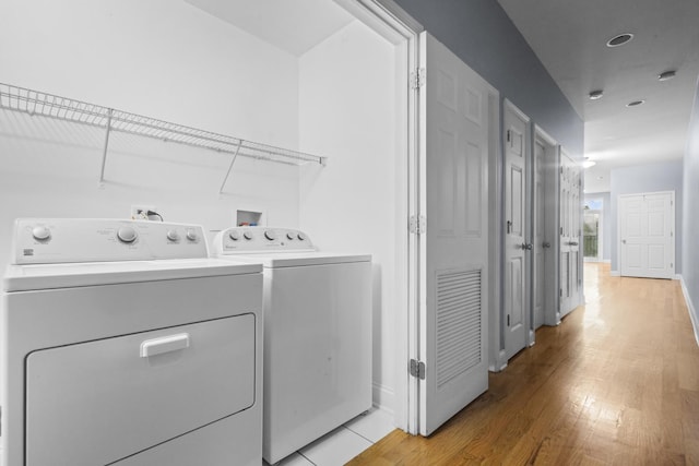 4532 S Indiana Ave Unit 2N, Chicago, IL 60653 - laundry area with independent washer and dryer, light wood-type flooring, and baseboards