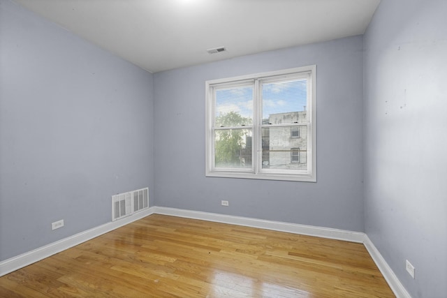 4532 S Indiana Ave Unit 2N, Chicago, IL 60653 - spare room featuring light wood-style floors and baseboards