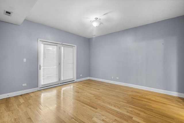4532 S Indiana Ave Unit 2N, Chicago, IL 60653 - unfurnished room with baseboards and light wood finished floors