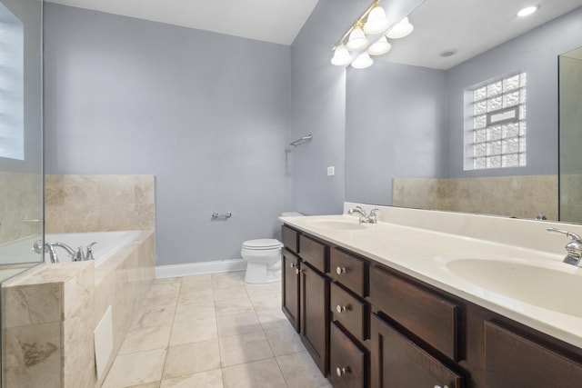 4532 S Indiana Ave Unit 2N, Chicago, IL 60653 - bathroom with a garden tub, double vanity, toilet, baseboards, and tile patterned flooring