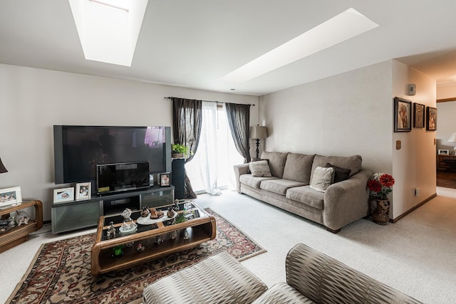 living room with carpet and a skylight
