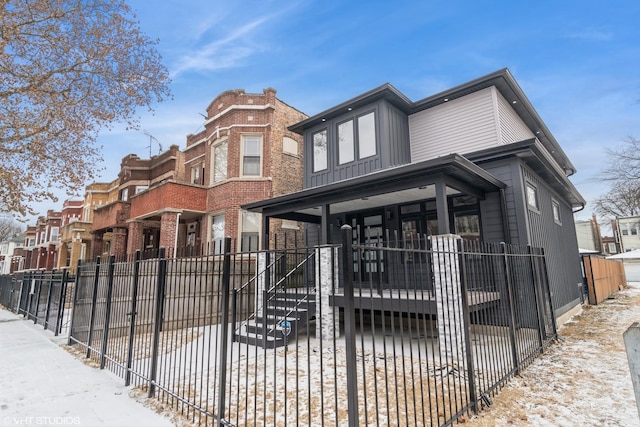 view of front of home with fence