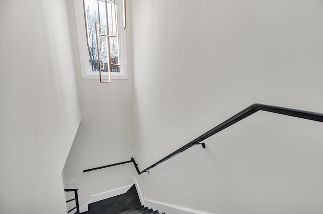 stairway featuring baseboards