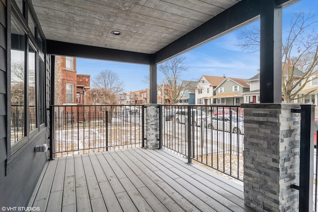 wooden terrace with a residential view