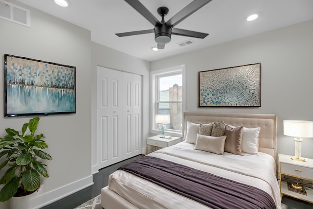 bedroom with a closet, visible vents, and recessed lighting