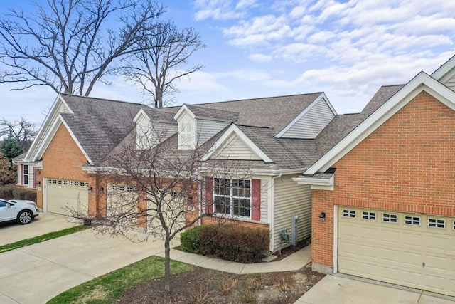 68 Tall Grass Ct, Streamwood, IL 60107 - view of front of home featuring concrete driveway, roof with shingles, and brick siding