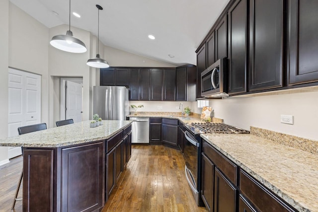68 Tall Grass Ct, Streamwood, IL 60107 - kitchen featuring a sink, dark wood-style flooring, stainless steel appliances, a breakfast bar, and hanging light fixtures