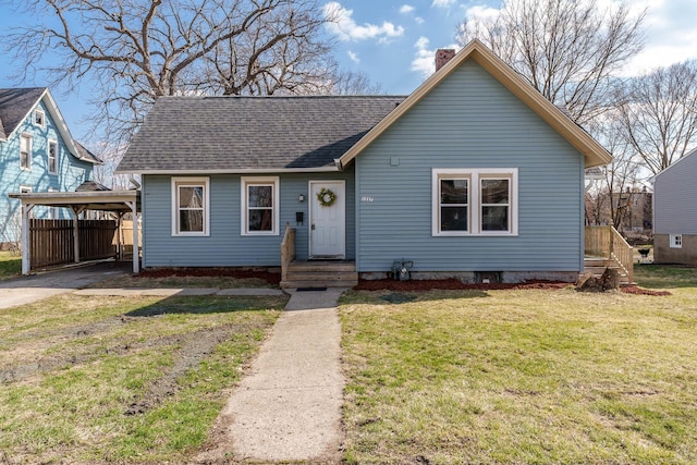 1227 5th Ave, Rockford, IL 61104 - bungalow-style home with a front yard, a carport, aphalt driveway, a chimney, and roof with shingles